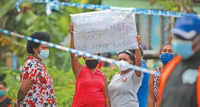 Muanikoso Village residents Inieta Naikau (L) and Amelia Senibuavoro during a peaceful protest on June 8 2021. Photo: Leon Lord