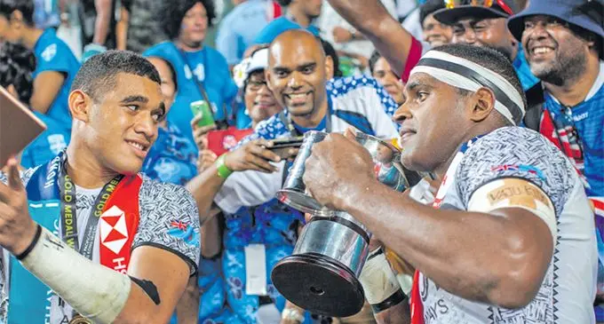 Fiji Airways Fijian 7s forwards Meli Derenalagi and Josua Vakurunabili with fans after the 21-7 Cup final victory against France at Hong Kong Stadium on April 7, 2019. Photo: Kitione Rokomanu/ZoomFiji