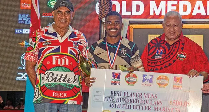Fiji Barbarians halfback and Fiji Bitter Marist 7 Best Player, Filipo Bukayaro is flanked by Joe Rodan Snr (left) and Prime Minister Voreqe Bainimarama at the ANZ Stadium, Suva, on March 26, 2022. Photo: Leon Lord.