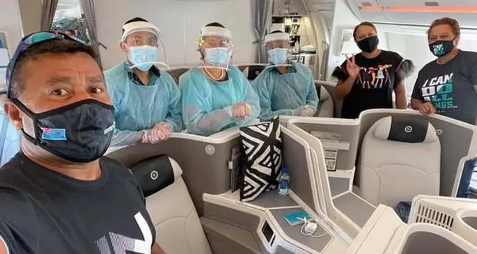 The Serevi family with Fiji Airways cabin crew on their flight back to the United States of America on May 11, 2021.