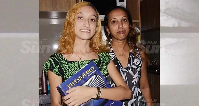 National Toppers Scholarship recipient, Matilda Simmons (left) with her mother Ranita Simmons. Photo: Ronald Kumar