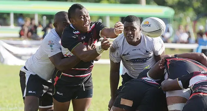  Naitasiri halfback Jone Navuso flicks a pass despite a tackle from Nadroga’s Emosi Vucago during the Skipper Cup clash at Lawaqa Park, Sigatoka, on August 15, 2020. Photo: Ronald Kumar