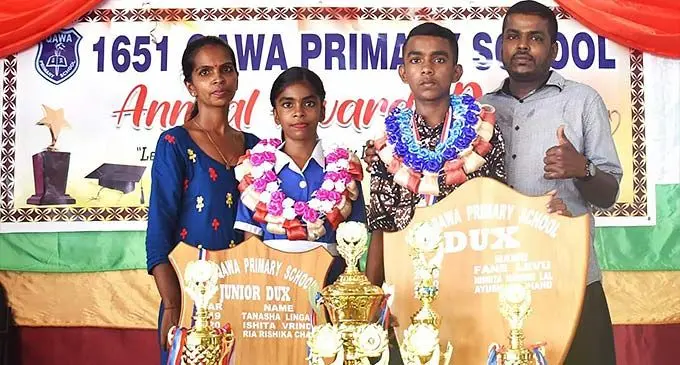Qawa Primary School dux Ayush Chand and Ria Chand with their parents Parneel Chand and Jotika Chand in Labasa on December 8, 2022.