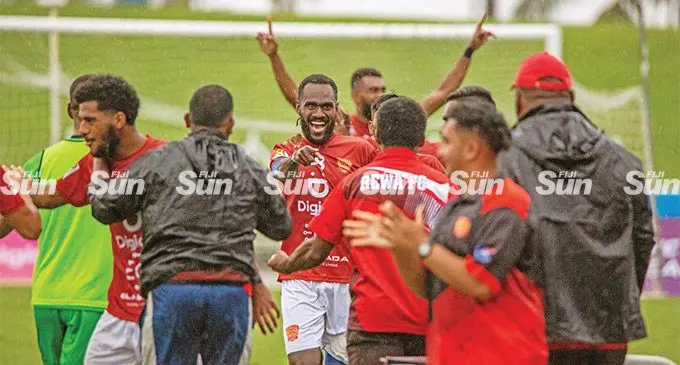 Rewa striker Alick Worworbu (facing camera) celebrates with the reserve players and officials are scoring their second goal in the OFC playoffs at the ANZ Stadium, Suva, on June 19, 2022. Photo: Leon Lord