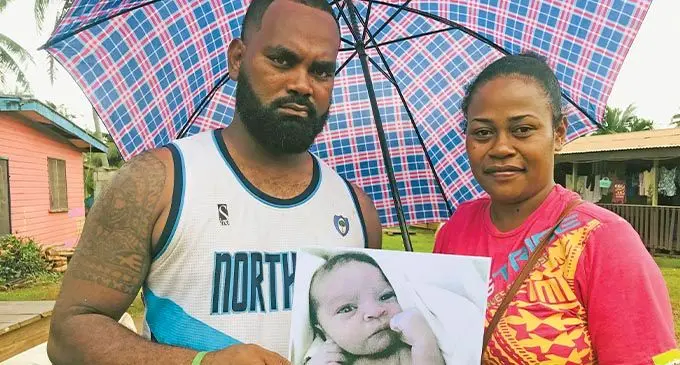 Distraught parents Sese Vananatoga and Mereseini Caucau hold a photo of their late newborn son Ulaiasi Turaga Vananatoga on March 3, 2022. Photo: Laisa Lui