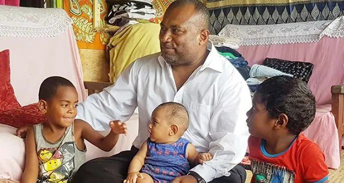 Minister for Health and Medical Services Dr Ifereimi Waqainabete at Wainadoi with Angelo Morris,6, (left) and Iowane Ravuama (on minister’s lap).