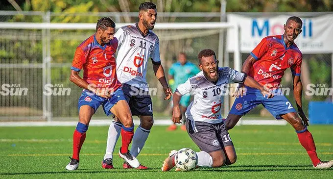 Suva striker Marlon Tahioa (10) cries foul as the Navua defenders challenge him during their Digicel Premier League clash at the Uprising Sports Centre in Pacific Harbour, Deuba, on April 10,2022. Photo: Leon Lord