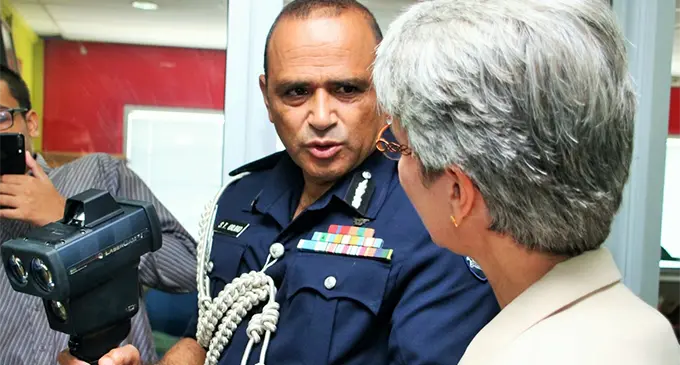 Police Commissioner Brigadier-General Sitiveni Qiliho holding the camera-equipped radar gun distributed by World Health Organisation representative Dr Corinnee Capuano (right).  Photo: Police Media Cell