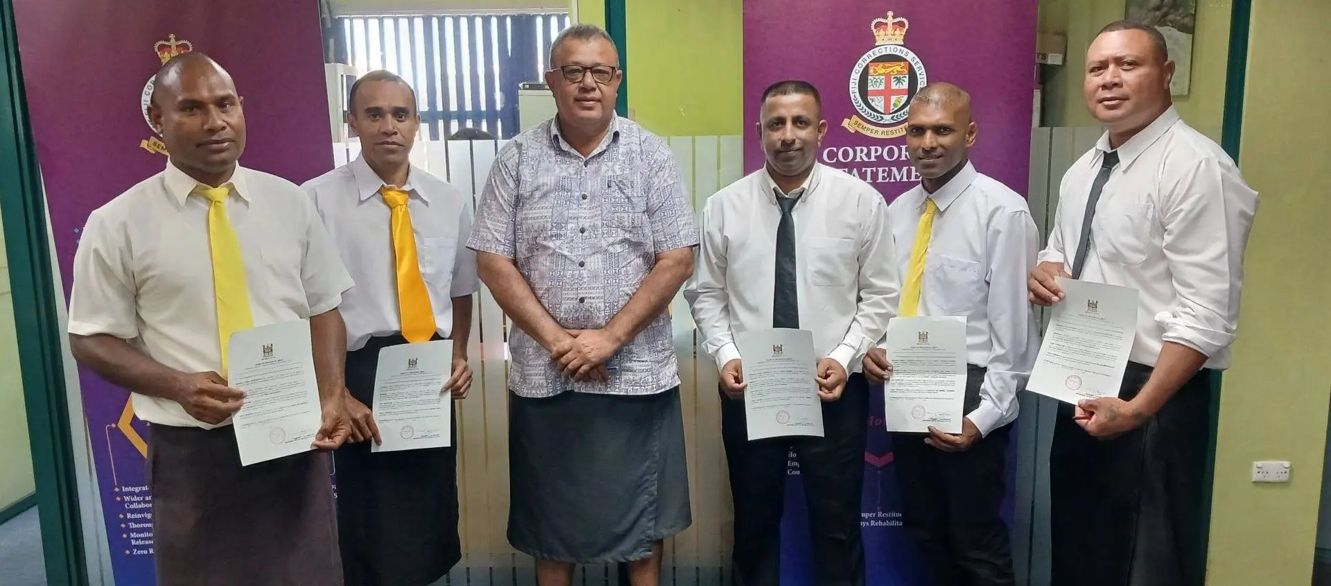 Acting Commissioner of the Fiji Corrections Service Sevuloni Naucukidi with the six inmates that received pardon.