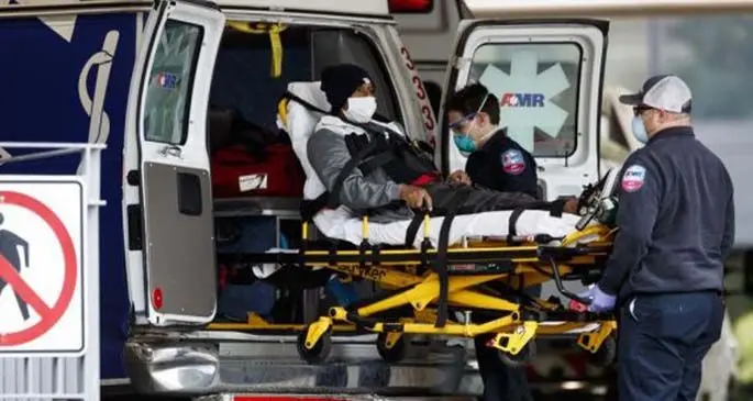 Medical workers carry a patient from an ambulance to George Washington University Hospital in Washington D.C., the United States, on April 27, 2020. (Photo by Ting Shen/Xinhua)