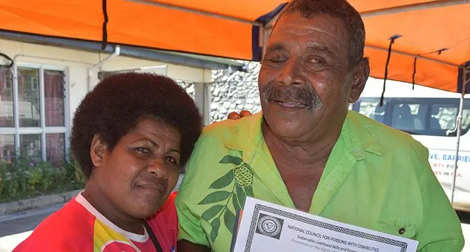 Vasikale Naisova graduate with Certificate in Basic Joinery/Woodcraft and Handicraft at the National Council For Persons With Disabilities in Labasa as he stands with his wife Ilaria Nawai on May 3,2019.  Photo: Shratika Naidu