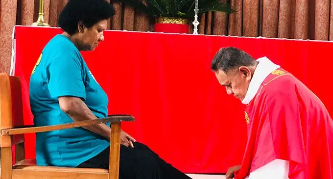 Cathedral washes the feet of church member Lusi Luvuri.  Photo: Shreeya Verma
