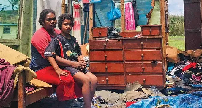 Ledua Qalo with her seven-year-old daughter Rosa Ligamasei inside their house in Dreketi, Macuata, damaged by Cyclone Yasa on December 18, 2020.  Photo: Shratika Naidu