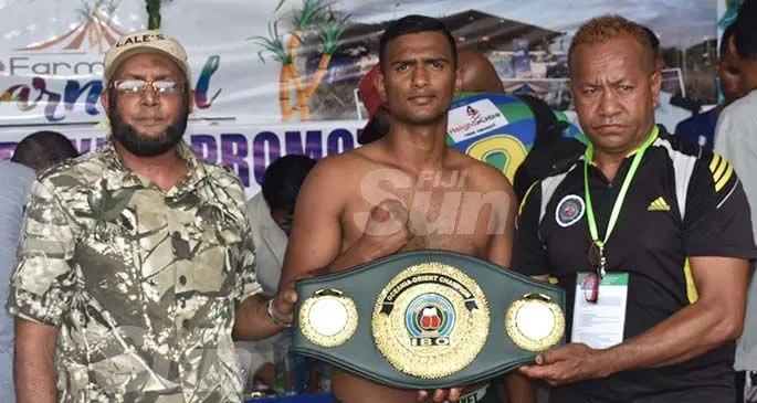 Sebastian Singh (middle) with the middleweight title during the weigh-in at the Prince Charles Park in Nadi last month. Photo: Waisea Nasokia