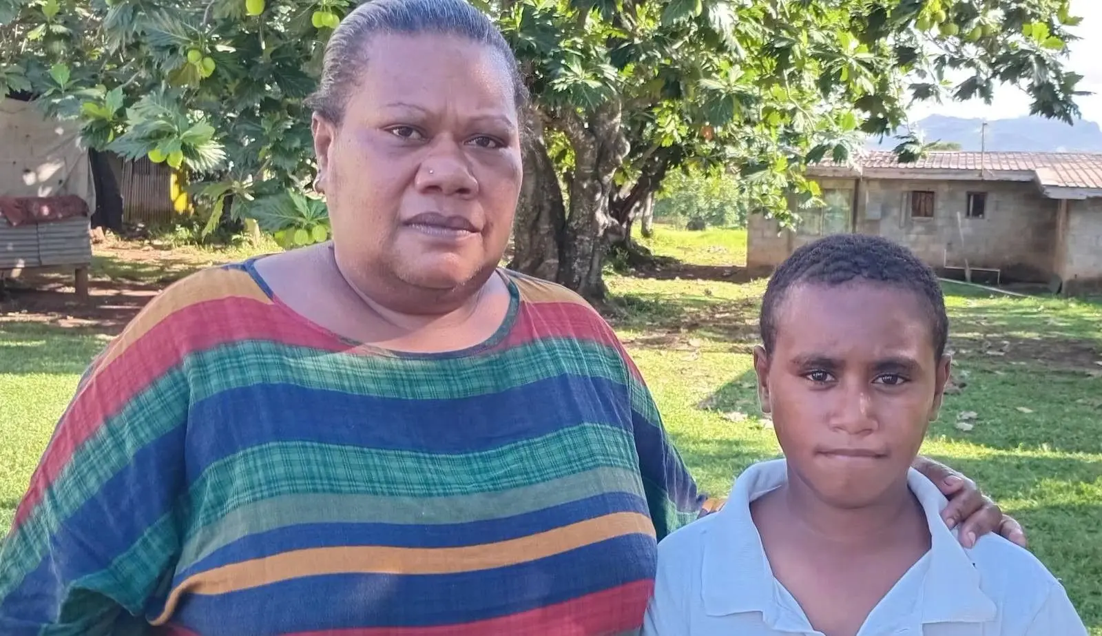 11-year-old Joji Bukete with his mother Laisani Mere.