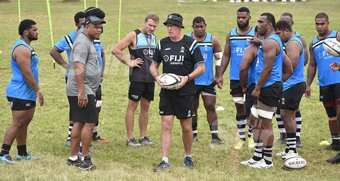 Fiji Airways Flying Fijians head coach John McKee (holding ball), with Senirusi Seruvakula (left), Brad Harris and the squad during training at the Fiji Airports ground in Namaka, Nadi, on November 7, 2019. Photo: Waisea Nasokia