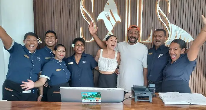 MasterChef Australia 2021 winner, Justin Narayan, and his wife Esther at Sails staff members. Photo: Tourism Fiji