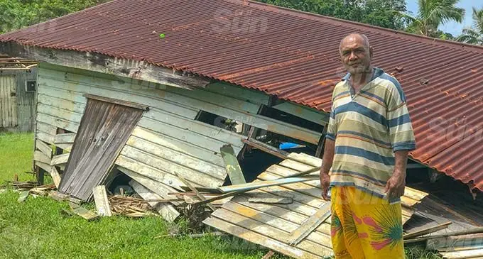 Ketei Village headman, Uludole Yanuyanulala standing in front of the home that was destroyed during Tropical Cyclone Yasa. Photo: Kelera Sovasiga