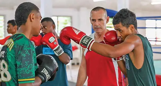 Boxing head coach Cam Todd (red vest) keeps a close eye at the young boxers who turned up for the first national youth and junior training camp in Suva on December 6, 2023. Photo: Sereana Salato