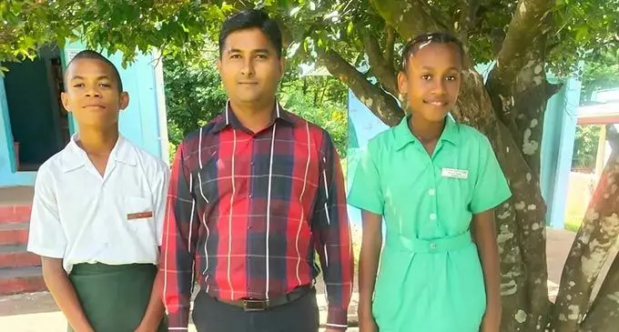 From left: head boy Amani Ratulevu, head teacher, Jitendra Kumar and head girl, Minikiti Tetoriki at Tokaimalo District School.