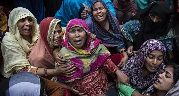 Women wail over their relatives who were killed in communal violence, in New Delhi, India, on Feb. 29, 2020. (Xinhua/Javed Dar)