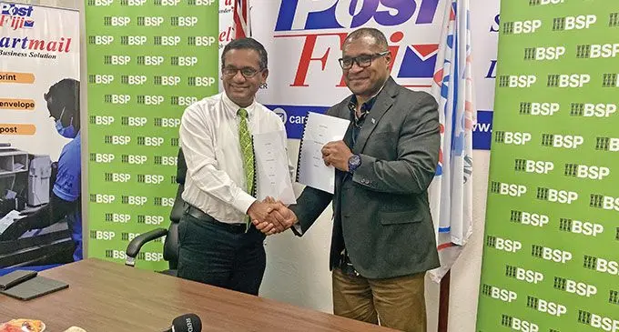 BSP Bank acting country head Rajeshwar Singh and Post Fiji chief executive officer Isaac Mow during the rural banking services agreement signing at the Post Fiji office in Suva on October 4, 2024.
