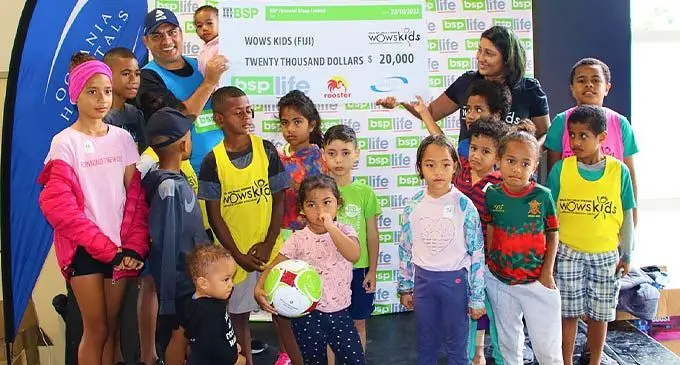 BSP Life managing director, Michael Nacola, hands over the cheque to WOWS director, Anabel Ali, at Albert Park at Albert Park pavilion on October 22, 2022. Photo: BSP Life