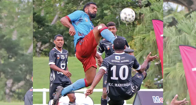 Towering Nasinu defender Taniela Rakariva executes a flying kick against RC Manubhai Ba striker Savenaca Nakalevu (10) while Samisoni Waqabuli (25) and Etonia Dogalau look during their Group B clash of the Digicel Fiji FACT at Lawaqa Park, Sigatoka, on May 29, 2022. Photo: Fiji FA Media