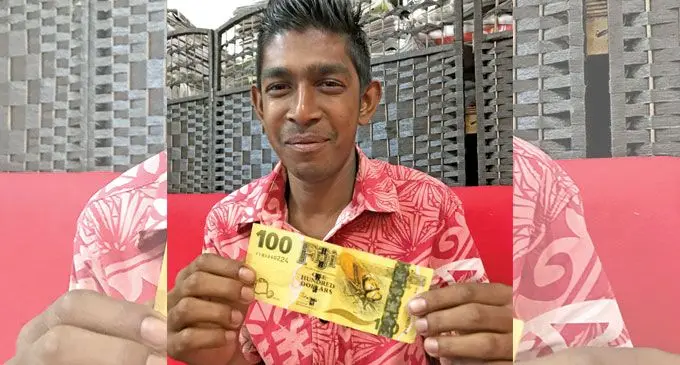 Shahil Deo in Labasa on June 9, 2022, with the $100 unemplyment assistance he received from Government. Photo: Shratika Naidu