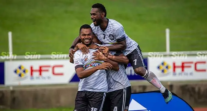 Suva’s Dave Radrigai (7) celebrates with teammate Waisake Navunigasau after they won the Courts Interdistrict Championship at the HFC Bank Stadium, Suva, on October 10,2022. Suva beat Navua 4-0. Photo: Leon Lord