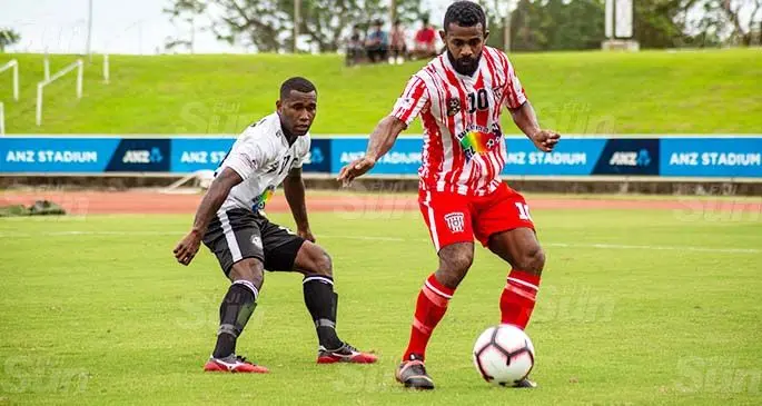 Jone Naraba (right) drives possession away from Suva’s Filipe Baravilala during the Pillay Garments Champion versus Champion series at ANZ Stadium, Suva, on February 222, 2021.Photo: Leon Lord