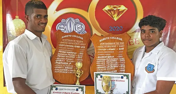 Sportsman of the Year winner Mosese Nauci (left) and Sportswoman of the Year Kelly Sharma with their awards during the Sabeto College annual prizegiving on December 3, 2020. Photo: Waisea NASOKIA.