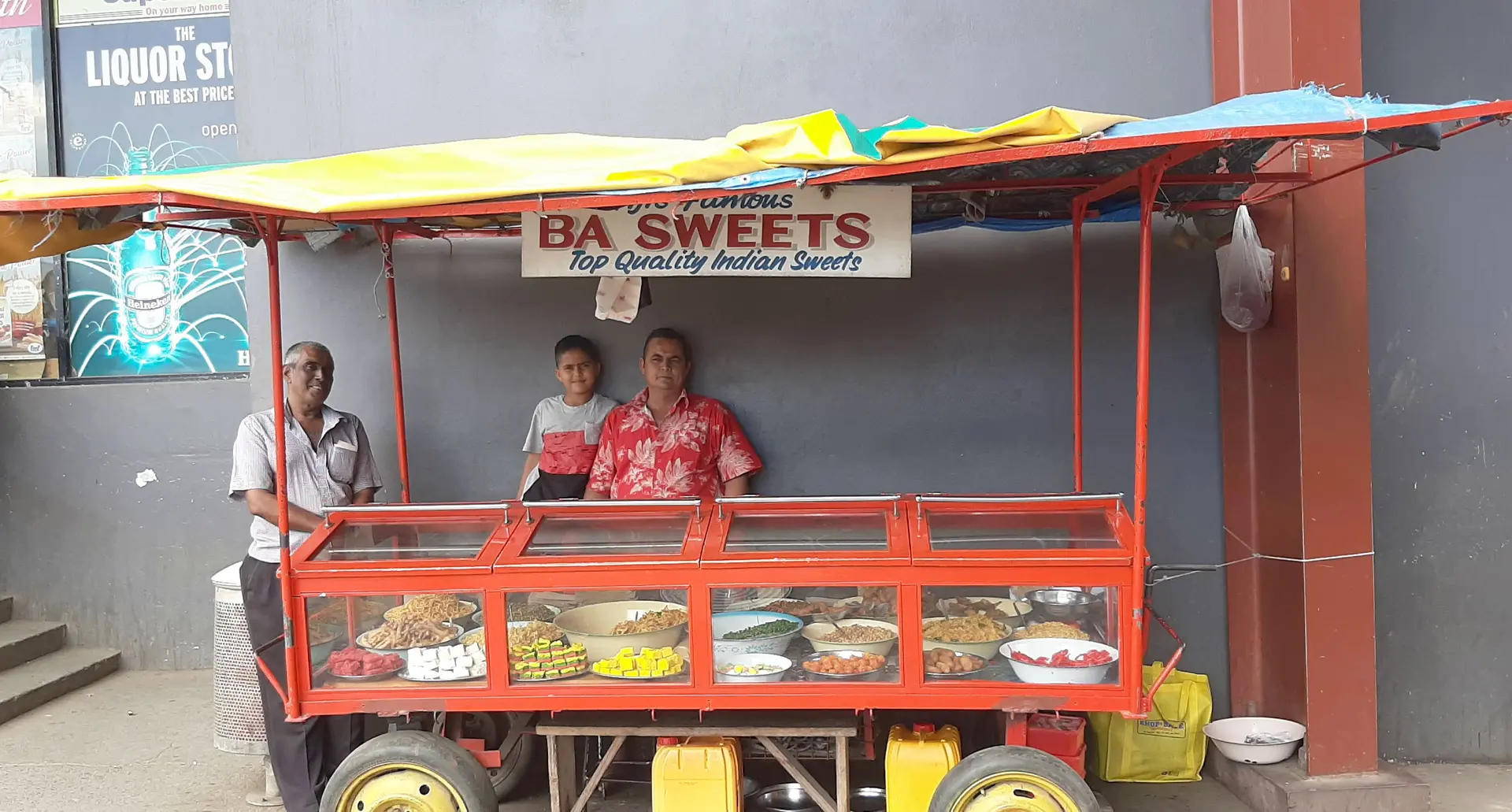 (From right) Virlesh Anand with his son and uncle Kamal Sharma at their stall in Lautoka.