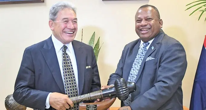New Zealand Deputy Prime Minister and Foreign Affairs Minister, Winston Peters (left), receiving a gift from the Minister for Defence, National Security and Foreign Affairs, Inia Seruiratu. Photo: DEPTFO News