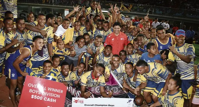 2018 Coca-Cola Games boys division winner, Ratu Kadavulevu School, with Acting Prime Minister and Attorney-General Aiyaz Sayed-Khaiyum at the ANZ Stadium in Suva on April 21, 2018. Photo: Ronald Kumar