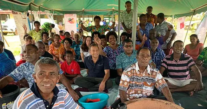 UN Resident Coordinator Sanaka Samarasinha (navy blue shirt), Minister for Agriculture, Waterways and Environment Mahendra Reddy with the people of Lekutu, Bua during the announcement of the Emergency Relief Fund in Votua Village on February 5,2021. Photo: UN