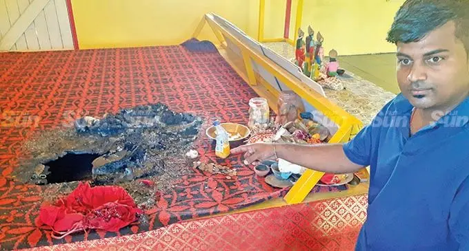 Pundit Vineshwar Sharma of Nav Durga Mandir in Baulevu,  Nausori shows the burnt Holy Ramayana at the temple on  January 27, 2022.  Photo: Ronald Kumar