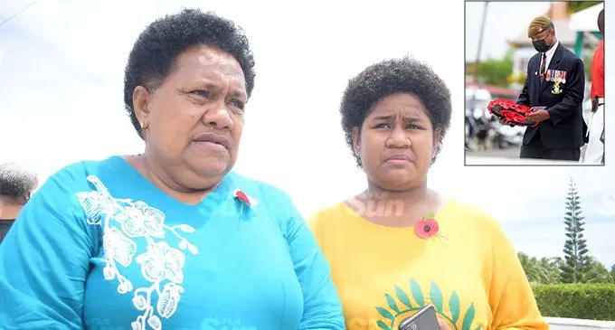 Lavenia Volaukitoga, 60, with her granddaughter, Wakesa Volaukitoga, 16, remember her late husband Private Seruvatu Volaukitoga during the Remembrance Day ceremony at the National War Memorial site in Veiuto on November 11, 2021. Insert: Former British Army soldier Joeli Biu. Photo: Ronald Kumar