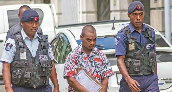 Accused Navua murderer Aliki Livai Tiko is escorted by police to his hearing at the Suva high court on the 15th Febuary 2021. Photo- Leon Lord