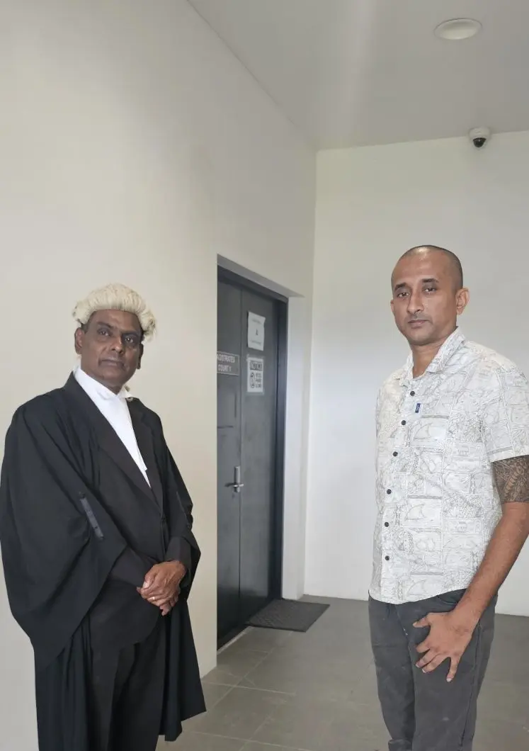 Lawyer Jiten Reddy (left) with his client Munendra at the High Court in Ba.