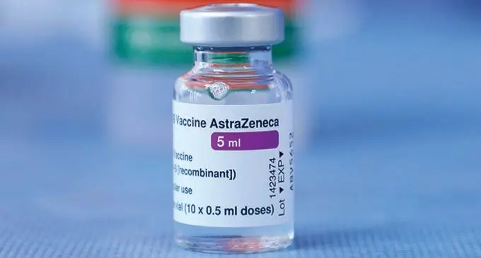 FILE - In this Wednesday, March 24, 2021 file photo, a vial of the AstraZeneca COVID-19 vaccination on a table prior to Croatia's Parliament Speaker Gordan Jandrokovic and Prime Minister Andrej Plenkovic being vaccinated, in Zagreb, Croatia. AstraZeneca says that its COVID-19 vaccine is strongly effective even after counting additional illnesses in its disputed U.S. study. The announcement late Wednesday was the latest in an extraordinary public rift with American officials. The drugmaker said it had recalculated data from that study and concluded the vaccine is 76% effective in preventing symptomatic COVID-19, instead of the 79% it had reported earlier in the week. (Admir Buljubasic/Pool via AP, File)