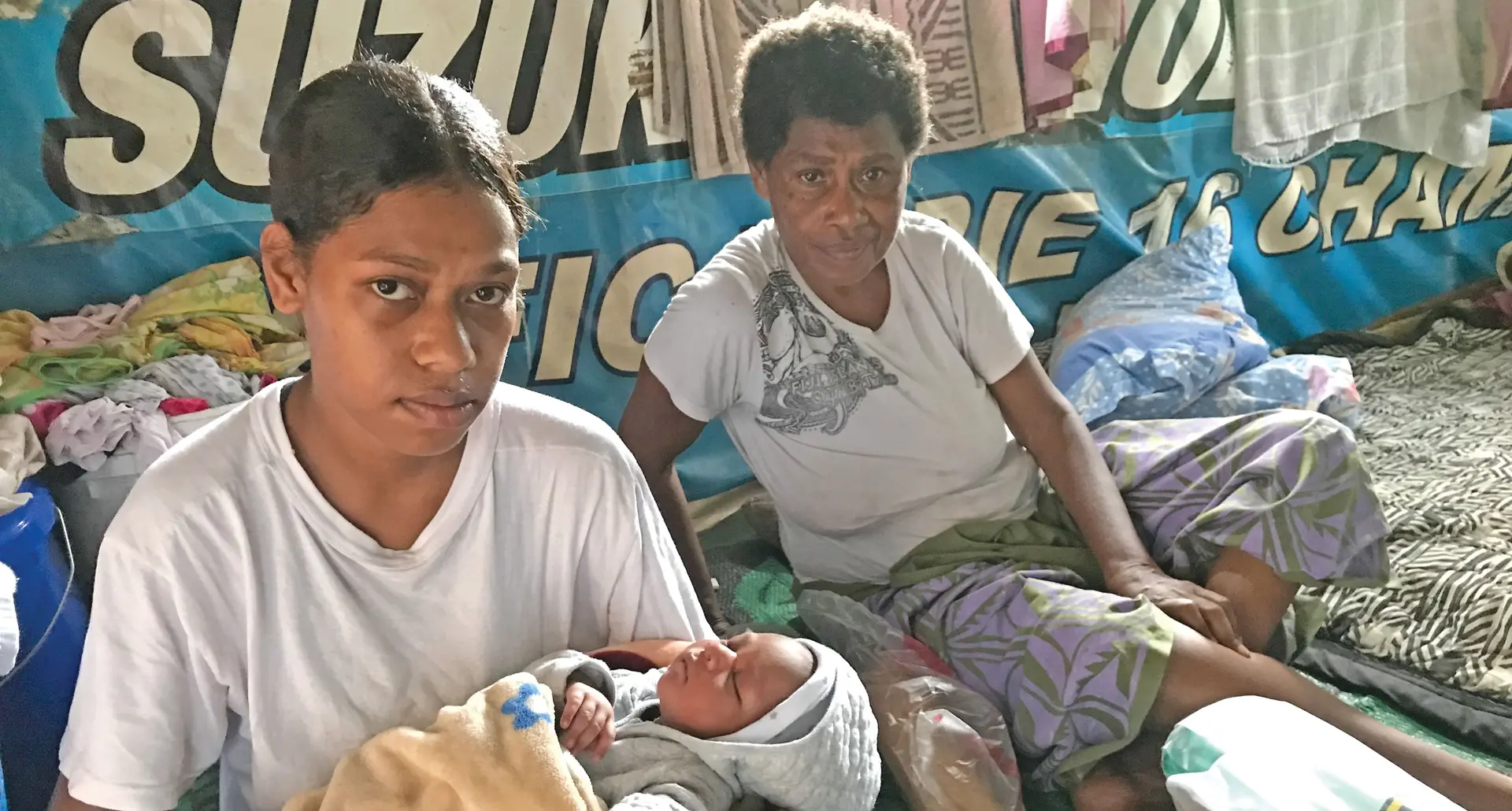 Losalini Lalaia with her three-week-old baby Taniela Lui at their Kalekana home as mum Arieta Ronaqato looks on.  Photo: Ivamere 