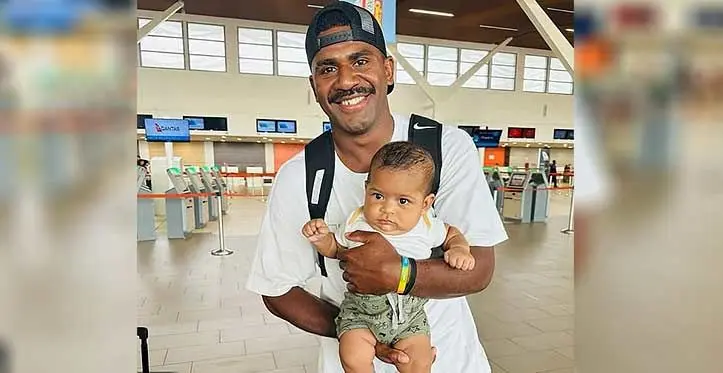 Bristol bound second five-eighth Kalaveti Ravouvou carries his nephew at Nadi International Airport on October 30, 2023. Photo: Fijian Drua