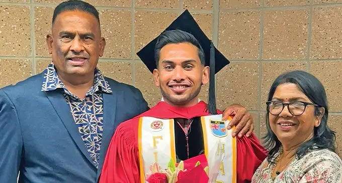 Nilendra Krishna Nair with parents Itendra Nair and Sabita Nair.