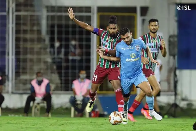 Roy Krishna (left) is challenged during the Indian Super League final against Mumbai City on March 13, 2021. Roy has scored 14 goals with eight assists during the competition. Photo: ISL