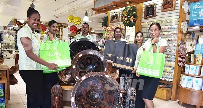 Staff members of Jack’s of Fiji in Nadi with their reusable woven bags at Denarau Marina. Photo: Mereleki Nai