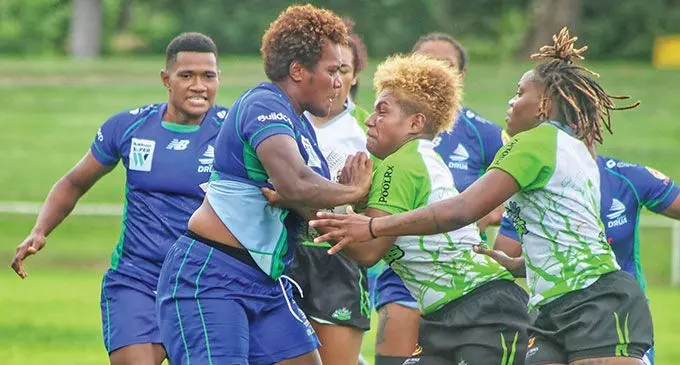 Rooster Chicken Fijiana Drua prop Mereoni Vonosere (left) tussles for the ball against Rhino Rugby Academy during their friendly match at Prince Charkes Park, Nadi, on March 15, 2023. Photo: FRU Media