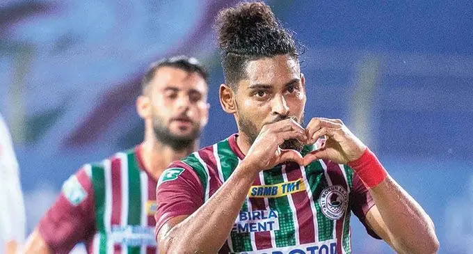 ATK Mohun Bagan’s Roy Krishna celebrates after socring a goal with Hugo Boumous behind him in their 4-2 win over Kerala Blasters on November 20, 2021. Photo: Telegraph Online
