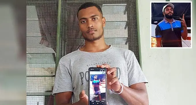 Waisea Nadevo holding a photo of his late cousin (insert) Dakuitoga Navuni.
