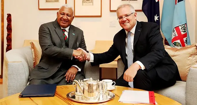 Prime Minister Voreqe Bainimarama and his Australian counterpart Scott Morrison congratulate each other after signing the Vuvale Partnership agreement in Canberra on September 16, 2019. Photo: PM’s Office